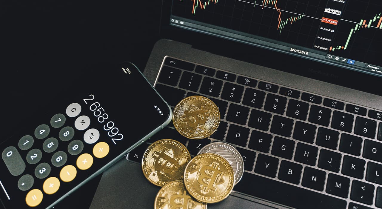 Laptop, phone and coins